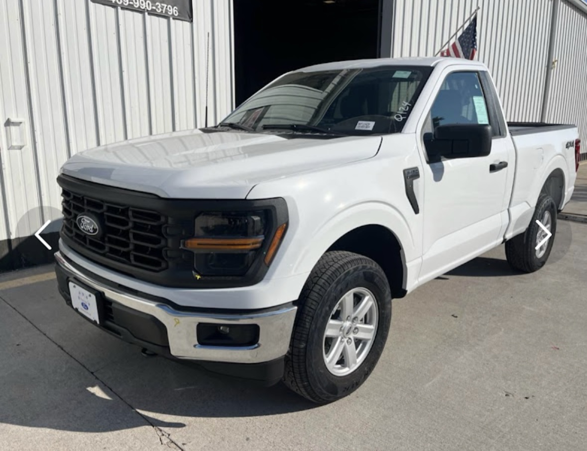 White F-150 at shop